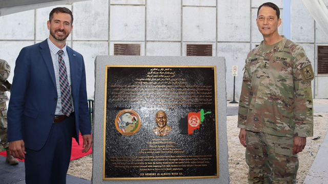 Mark Kitz, then-Program Executive Officer Intelligence, Electronic Warfare & Sensors, and Lt. Gen. (Ret) Robert Marion, then Principal Military Deputy ASA(ALT), with the Maj. Gen. Harold Greene plaque at the Myer Auditorium at Aberdeen Proving Ground, Maryland. (Photo Credit: Courtesy photo)