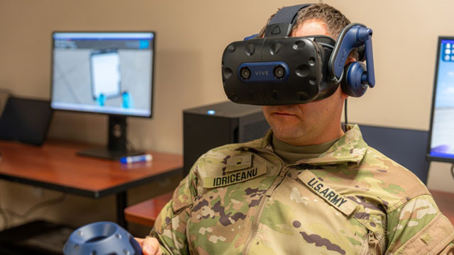 A Soldier receiving immersive, task-based training in a modular virtual reality headset. The VAST classroom represents a transformational shift in how the Army can approach mission equipment training, environment, eliminating dependency on scarce flight hours while increasing fidelity, safety, and repeatability of mission-critical tasks. (Photo Credit: U.S. Army Photo)