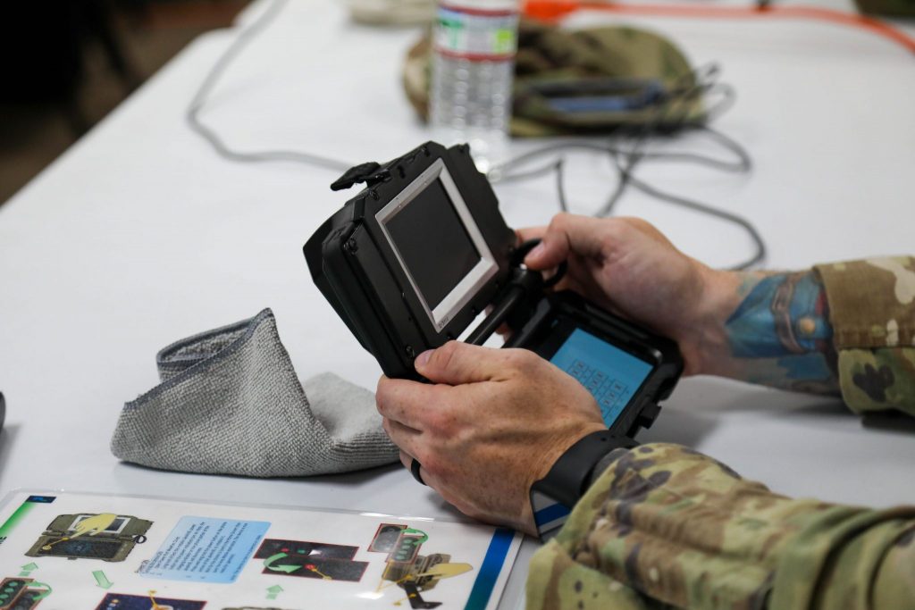 A Soldier practices enrolling a subject on a mobile biometrics collection device.